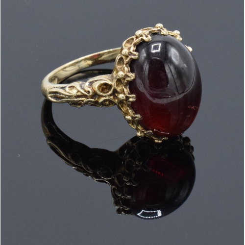 210 - A hallmarked 9ct gold ornate ladies ring set with a polished cabochon stone, gross weight 5.5 grams.... 