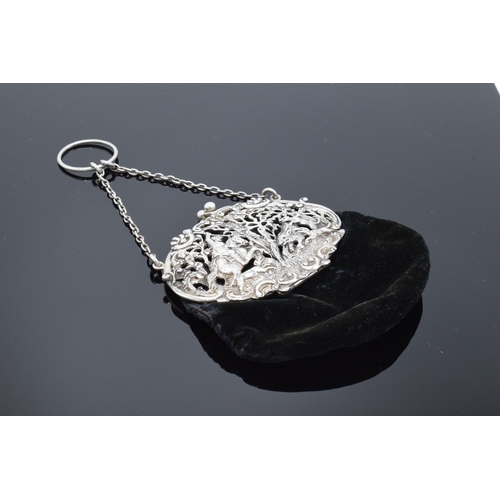 212 - An ornate silver ladies velvet purse with a ball clasp depicting a hunting scene. Hallmarked for Lon... 