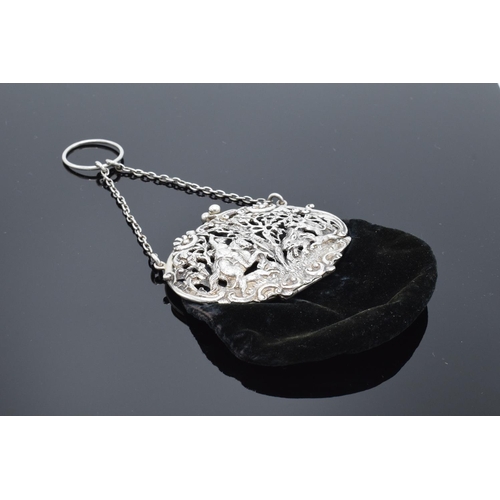 212 - An ornate silver ladies velvet purse with a ball clasp depicting a hunting scene. Hallmarked for Lon... 