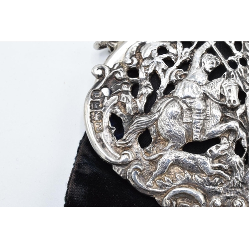 212 - An ornate silver ladies velvet purse with a ball clasp depicting a hunting scene. Hallmarked for Lon... 