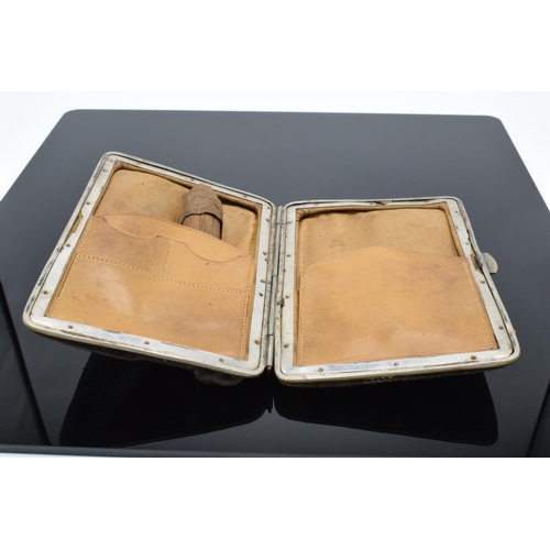 215 - A leather cigar case with a silver mount hallmarked for Birmingham 1897 with a cigar inside. In used... 