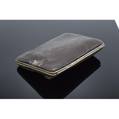 215 - A leather cigar case with a silver mount hallmarked for Birmingham 1897 with a cigar inside. In used... 