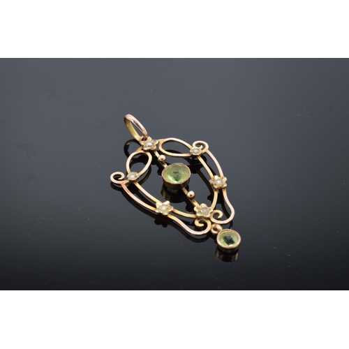 217 - An antique 9ct gold ornate pendant set with peridot and pearls. Gross weight 2.1 grams. Stamp to rea... 