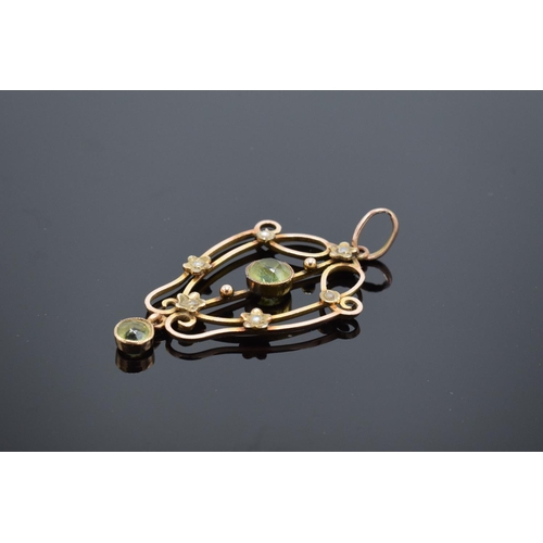 217 - An antique 9ct gold ornate pendant set with peridot and pearls. Gross weight 2.1 grams. Stamp to rea... 