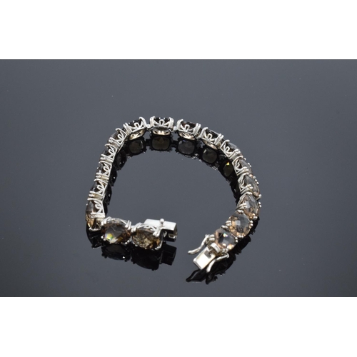 218 - A silver ladies bracelet set with smoky quartz stones, 19.5cm in length. Hallmarked 925 for Birmingh... 