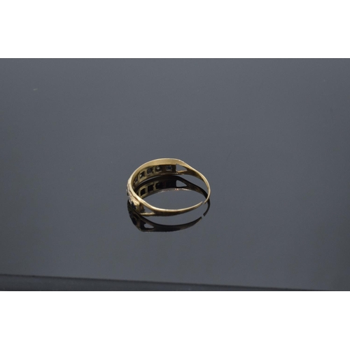 222 - A 9ct gold ladies ring set with diamond and sapphires (possibly synthetic). The band has been cut. G... 