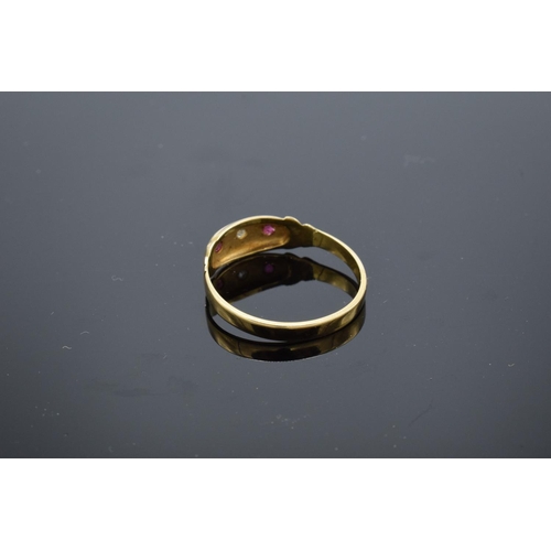 226 - 18ct gold ladies ring set with rubies and a diamond stone. UK size P/Q. Gross weight 2.2 grams. Unma... 