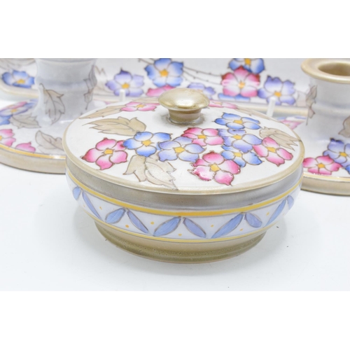 23 - A collection of Bursley Ware Charlotte Rhead pottery in a tubelined floral design 'TL4' to include a... 