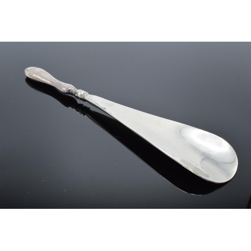 235 - A silver handled shoehorn. Birmingham 1913.