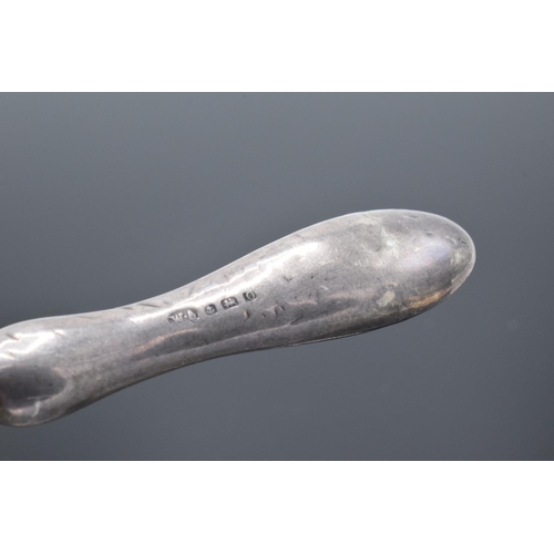 235 - A silver handled shoehorn. Birmingham 1913.