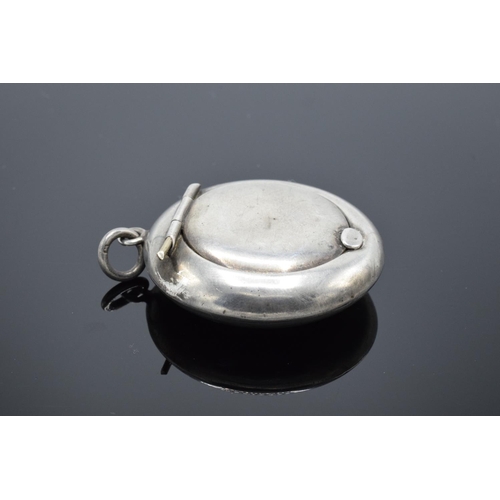 236 - A silver circular compact with mirror contained in the lid Birmingham 1918. 11.9 grams gross weight.... 