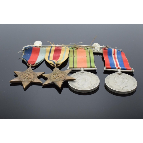 242a - A group of World War Two medals set on a bar to include the 1939-1945 Star, The Africa Star, The 193... 