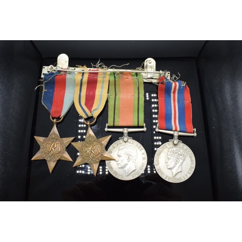 242a - A group of World War Two medals set on a bar to include the 1939-1945 Star, The Africa Star, The 193... 