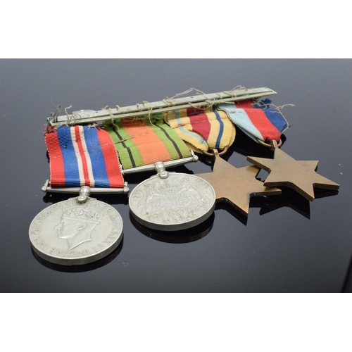 242a - A group of World War Two medals set on a bar to include the 1939-1945 Star, The Africa Star, The 193... 