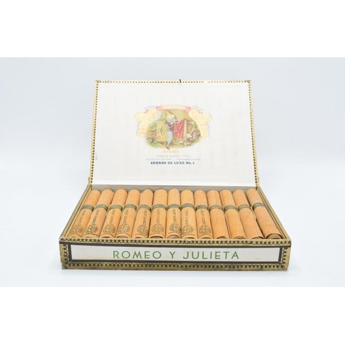 A cased set of 25 Romeo y Julieta Cedros De Luxe No.1 cigars made in Habana, Cuba. Appear to be in good condition. Box is showing signs of age and wear etc. there is a nail in the lid of the box to act as a catch. Tobacciana and smoking Interest.