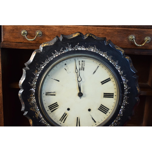 256 - A Victorian papier-mache wall clock decorated with Mother of Pearl inlay with Roman numerals painted... 