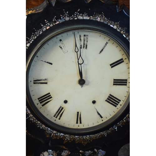 256 - A Victorian papier-mache wall clock decorated with Mother of Pearl inlay with Roman numerals painted... 