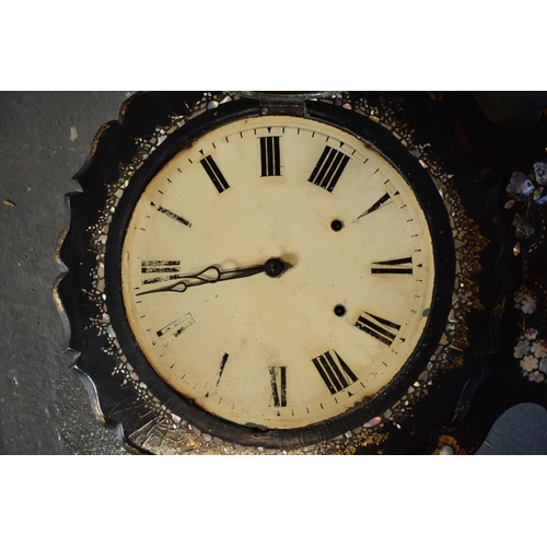 256 - A Victorian papier-mache wall clock decorated with Mother of Pearl inlay with Roman numerals painted... 