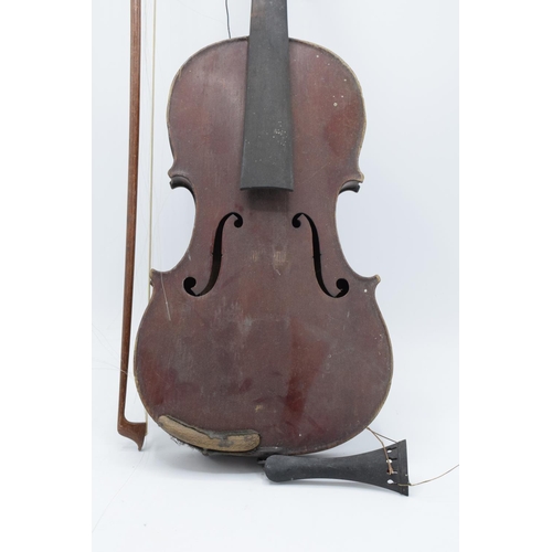 257 - A late 19th/ early 20th century violin and associated bow with the following label on the inside 'E.... 