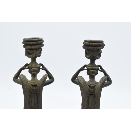 261 - A pair of 19th century Grand Tour Bronze candlesticks depicting ladies with wings holding an urn on ... 