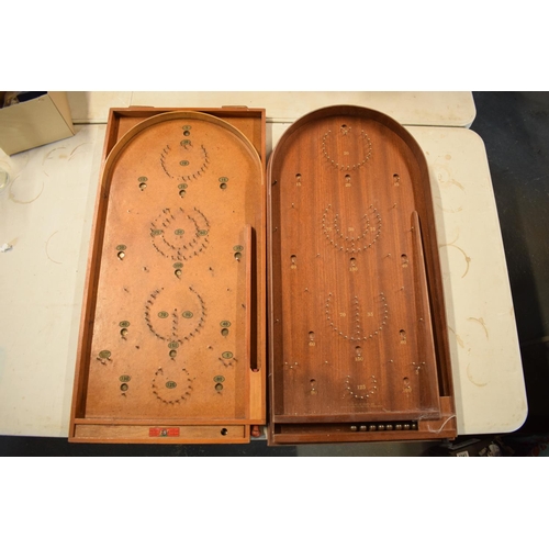 264 - A pair of 20th century wooden bagatelle games complete with associated balls. One is made by Chad Va... 