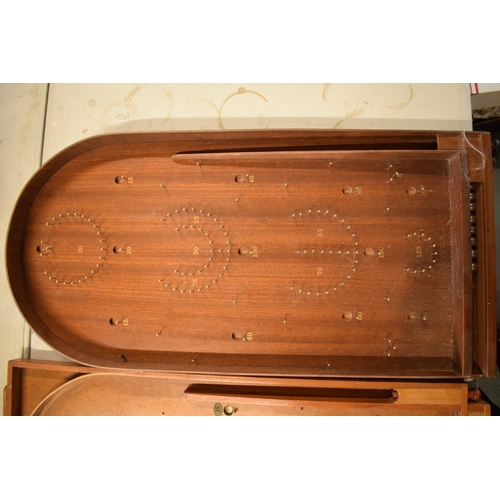 264 - A pair of 20th century wooden bagatelle games complete with associated balls. One is made by Chad Va... 