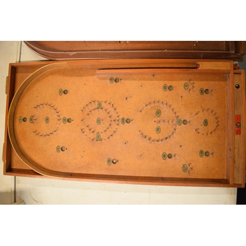 264 - A pair of 20th century wooden bagatelle games complete with associated balls. One is made by Chad Va... 