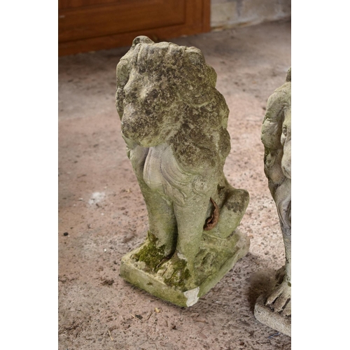 275 - A pair of vintage reconstituted stone upright lions (2). 42 x 15 x 29cm.