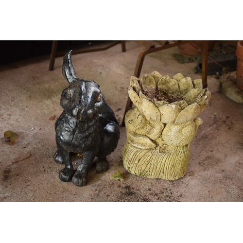 279 - A pair of garden ornaments to include a metal rabbit (missing an ear) and a concrete rabbit planter ... 