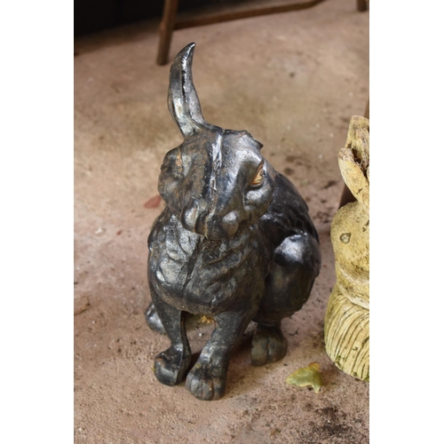 279 - A pair of garden ornaments to include a metal rabbit (missing an ear) and a concrete rabbit planter ... 