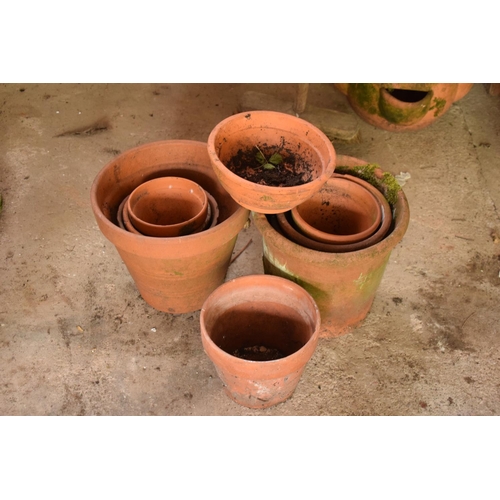 281 - A collection of 20th century terracotta garden pots and planters approx 8-10