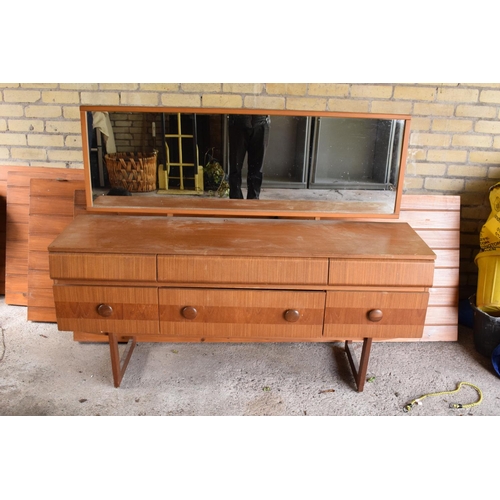 292 - A 1960s G-Plan style teak veneer mirror backed sideboard