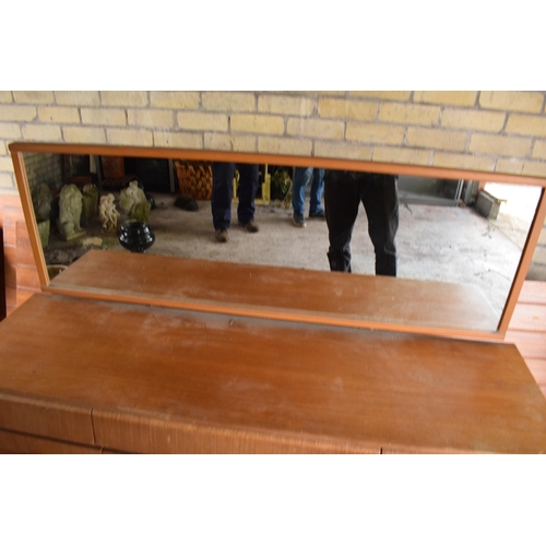 292 - A 1960s G-Plan style teak veneer mirror backed sideboard