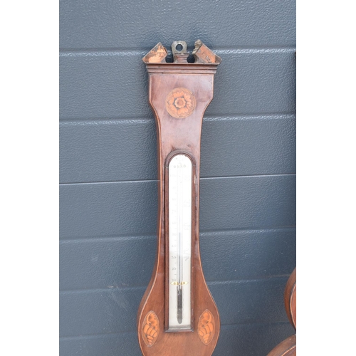 293 - A pair of 19th century mahogany barometers one with inlaid motifs such as shell (both a/f). Please c... 