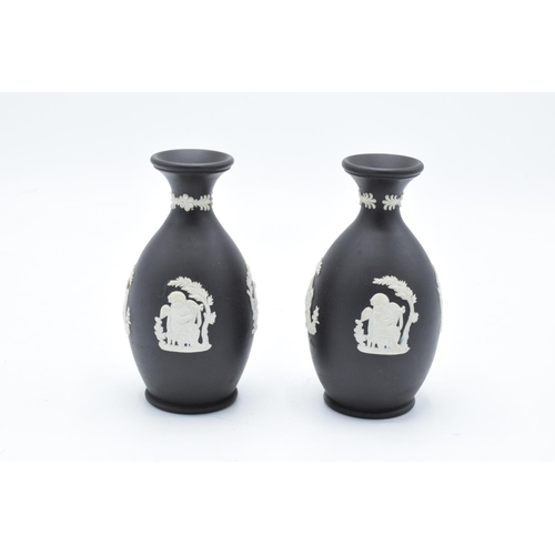 53 - A pair of black Wedgwood Jasper ware vases. In good condition with no obvious damage or restoration.... 