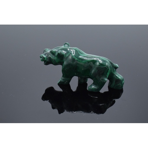 220A - A mixed collection of items to include a malachite figure depicting a rhino, a malachite beaded neck... 