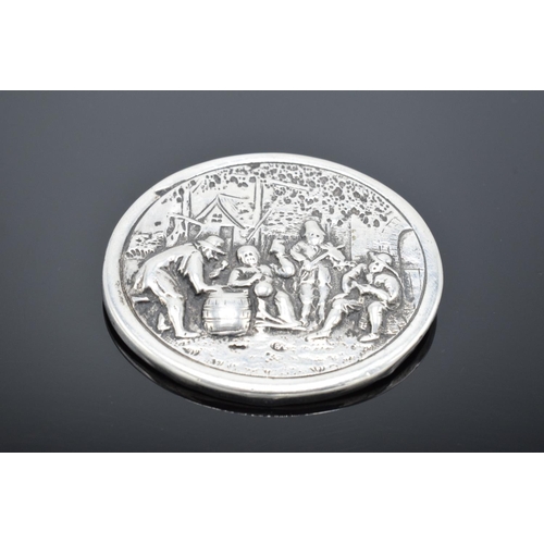 220B - A late 19th/ early 20th century circular silver brooch depicting dutch style scenes with a base meta... 