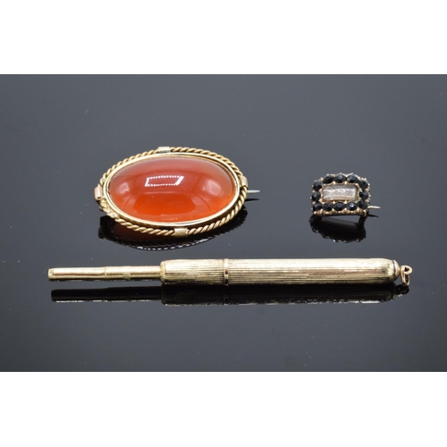 220C - A collection of items to include a 15ct Victorian carnelian brooch (tested as 15ct) (gross weight 9.... 