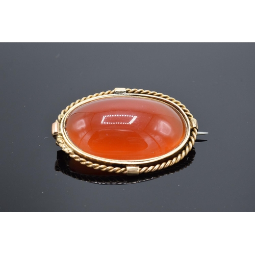 220C - A collection of items to include a 15ct Victorian carnelian brooch (tested as 15ct) (gross weight 9.... 