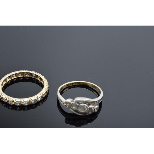 220D - An antique gold eternity ring set with clear stones (tests as 9ct) UK size K/L (gross weight 1.3 gra... 