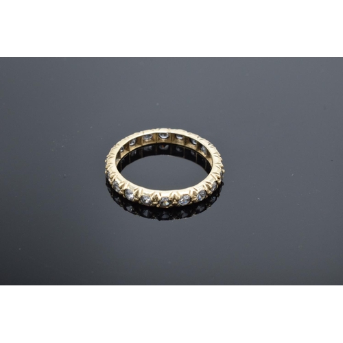 220D - An antique gold eternity ring set with clear stones (tests as 9ct) UK size K/L (gross weight 1.3 gra... 