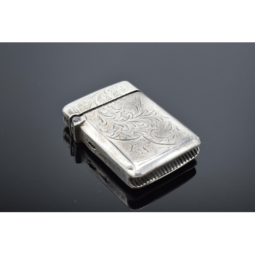 220F - A collection of silver and silver coloured items to include a vesta case (Birmingham 1902) (holes to... 