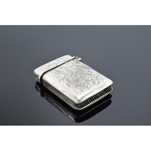 220F - A collection of silver and silver coloured items to include a vesta case (Birmingham 1902) (holes to... 