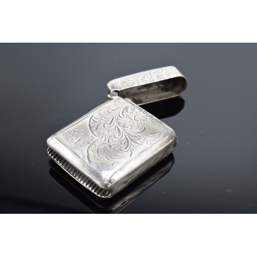 220F - A collection of silver and silver coloured items to include a vesta case (Birmingham 1902) (holes to... 