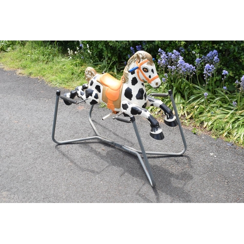 332 - A vintage 20th century Mobo metal spring mounted rocking horse. In good condition with signs of age-... 