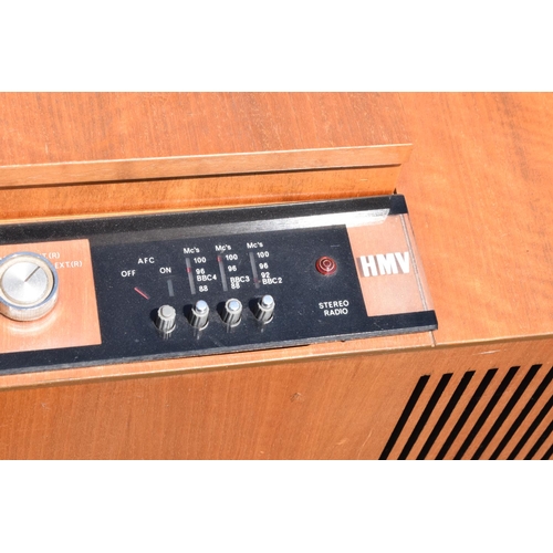 334 - HMV teak radiogram unit. 96 x 44 x 60cm. In good condition with signs of age-related wear and tear. ... 