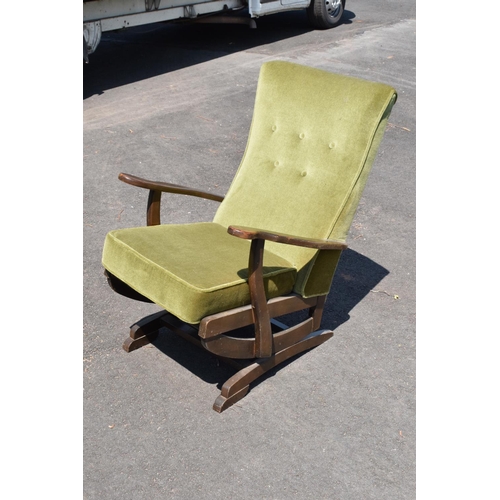 335 - An early to mid 20th century American-style upholstered wooden rocking chair with spring action rock... 