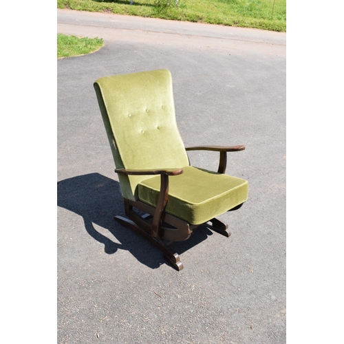 335 - An early to mid 20th century American-style upholstered wooden rocking chair with spring action rock... 