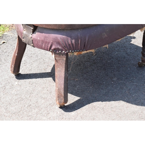 336 - Late Victorian leather tub library chair on caster wheels. 84cm tall.  In need of some attention wit... 