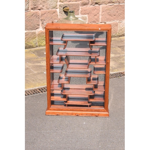 337 - A 20th century fruit wood style ornate display cabinet. 53 x 13 x 75cm tall.